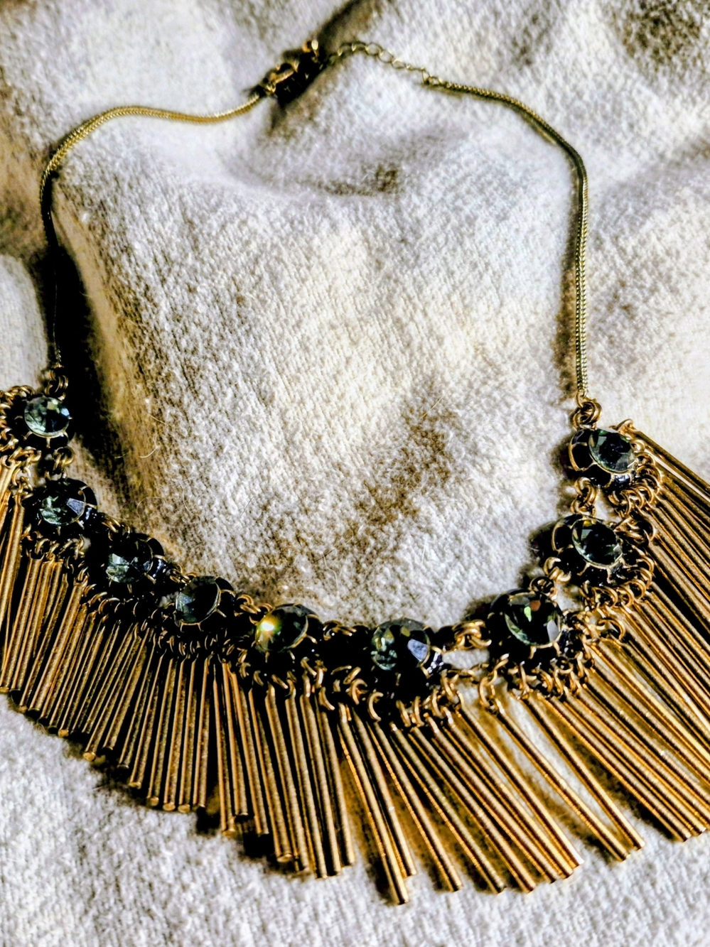 Gold Fringe Statement Necklace with Dark Green Gem Accents